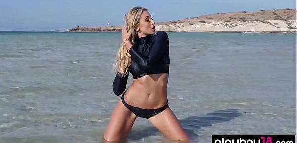  Bombastic diver with big boobs stripping at the beach
